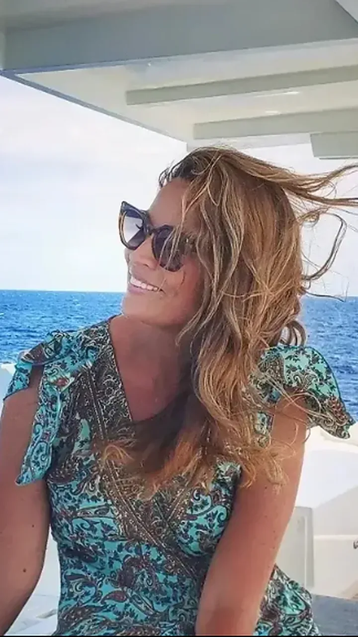 Rayne on a boat, hair in the wind